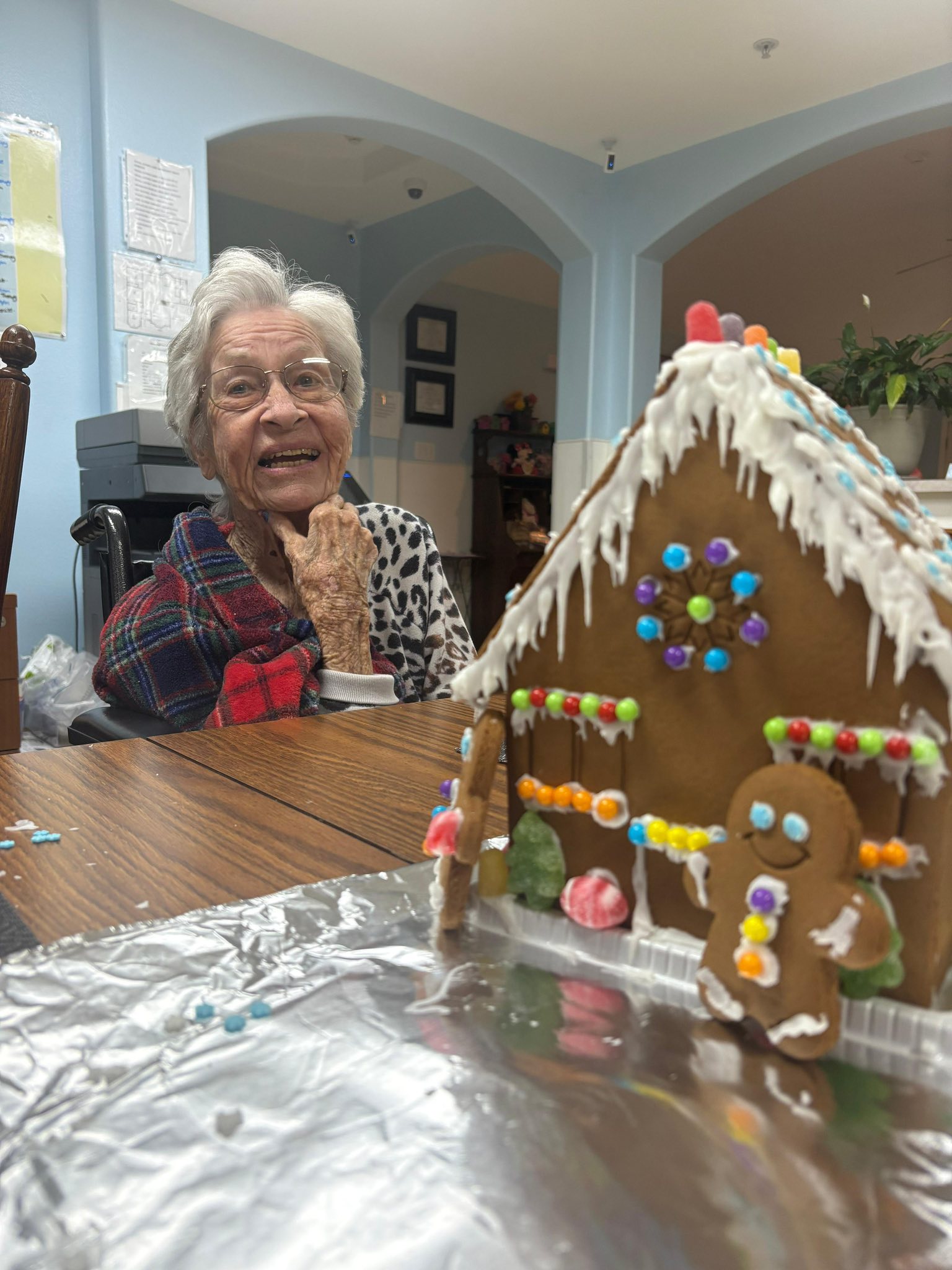 A smiling resident enjoying a calming holiday activity